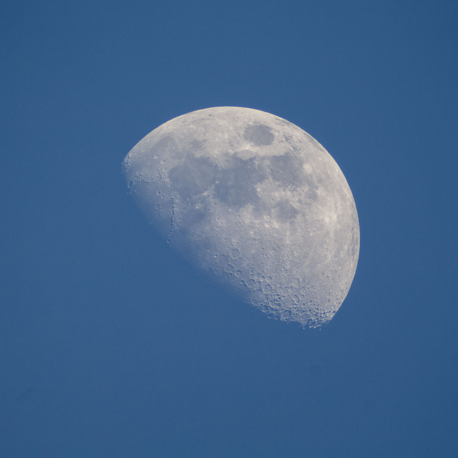 Waxing gibbous crescent moon in an evening sky
